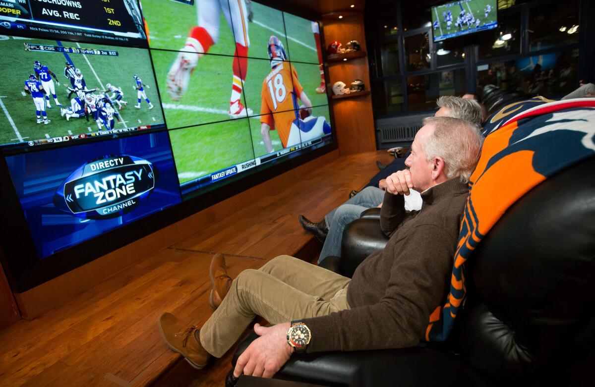 Archie Manning, father of Giants quarterback Eli Manning and Broncos quarterback Peyton Manning; watches both his sons play on two screens on Nov. 15, 2015.