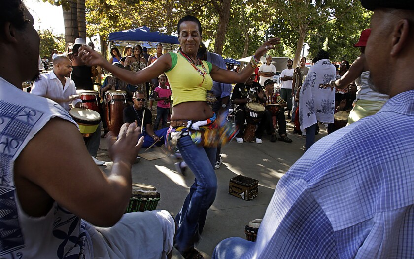 Drummers and dancers converge on Leimert Park, a hub of African American culture. Supporters of the station say the area would benefit from the tourism and foot traffic that the train would bring.