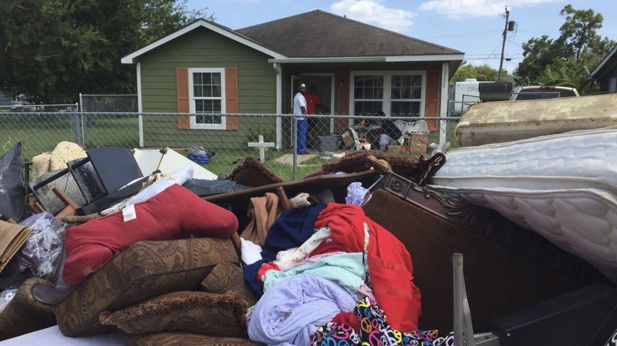 Steven Williams helped his wife clean out her grandmother's house after Hurricane Harvey flooded their town of Port Arthur. Very little could be saved from the house.