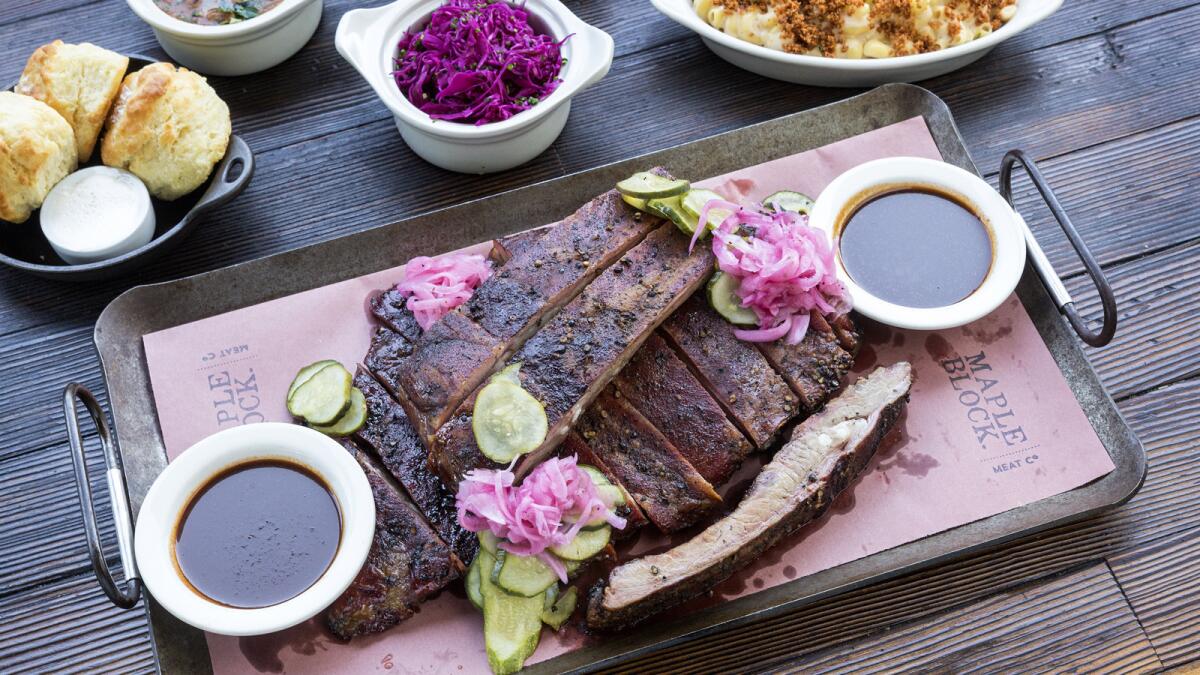 Full rack of pork spare ribs and side orders at Maple Block Meat Co. in Culver City.