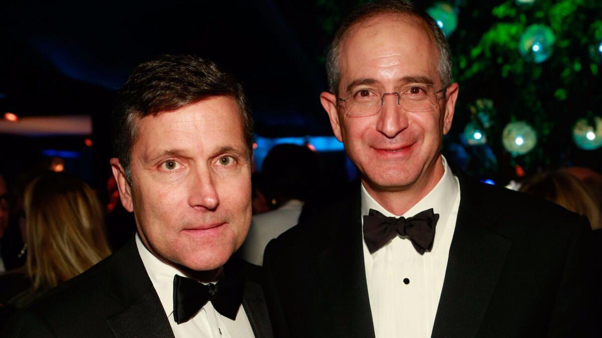 NBCUniversal Chief Executive Steve Burke, left, and his boss, Comcast Chairman and Chief Executive Brian Roberts, following the Golden Globes ceremony in Beverly Hills in 2013.