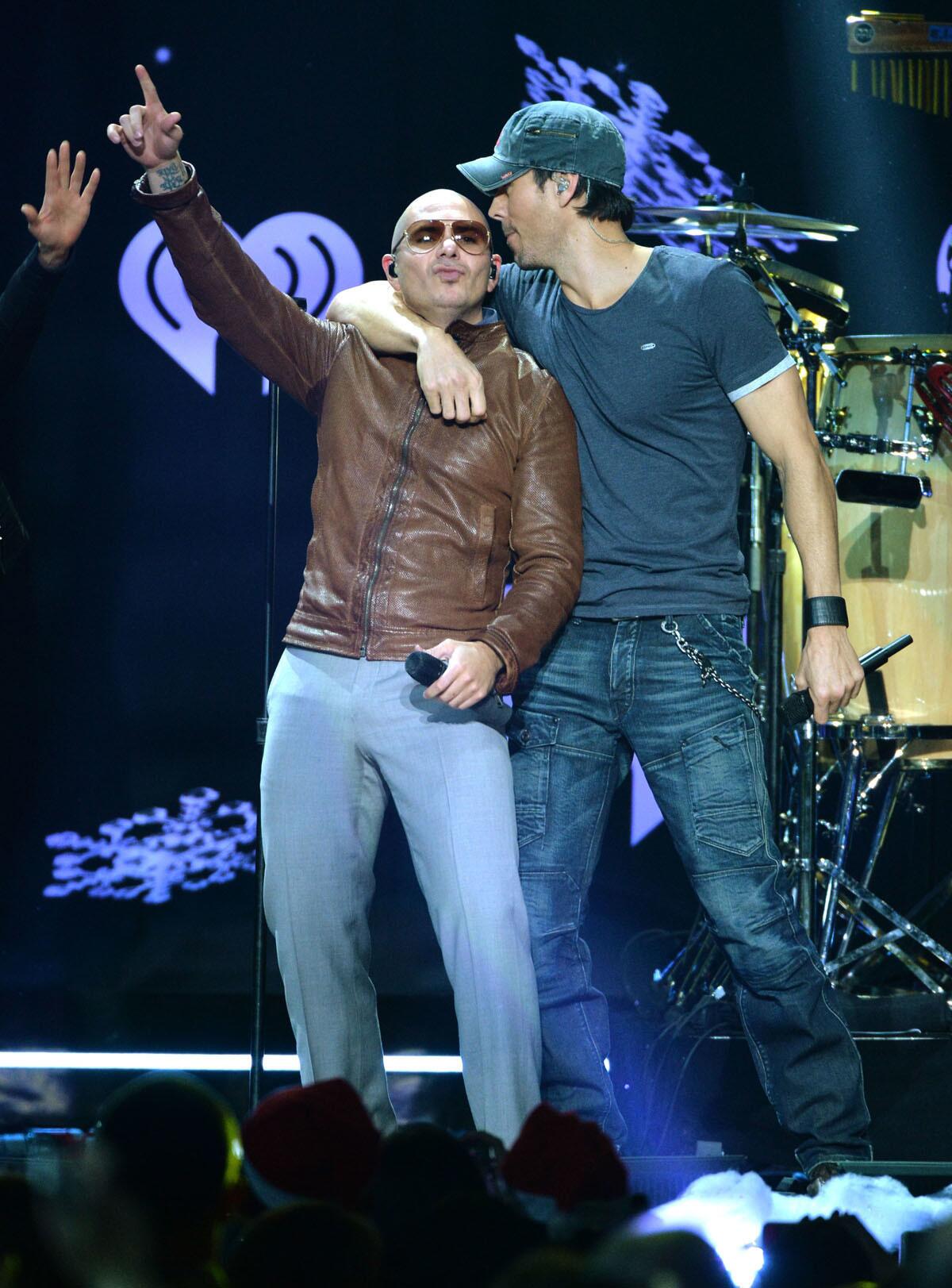 Pitbull (left) and Enrique Iglesias will bring their current tour to San Diego in October. (Larry Busacca/Getty Images for Clear Channel)