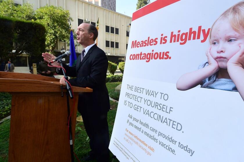 Dr. Jeffrey Gunzenhauser, Interim Health Officer from the Los Angeles County Department of Public Health, briefs the media outside the Department of Public Health in Los Angeles, California on February 4, 2015, with a general update of the measles outbreak in Los Angeles County. The measles outbreak centered in California has sparked nationwide debate over the issue of parents choosing to or not to vaccinate their children. AFP PHOTO / FREDERIC J. BROWN (Photo credit should read FREDERIC J. BROWN/AFP/Getty Images) ** OUTS - ELSENT, FPG, CM - OUTS * NM, PH, VA if sourced by CT, LA or MoD **