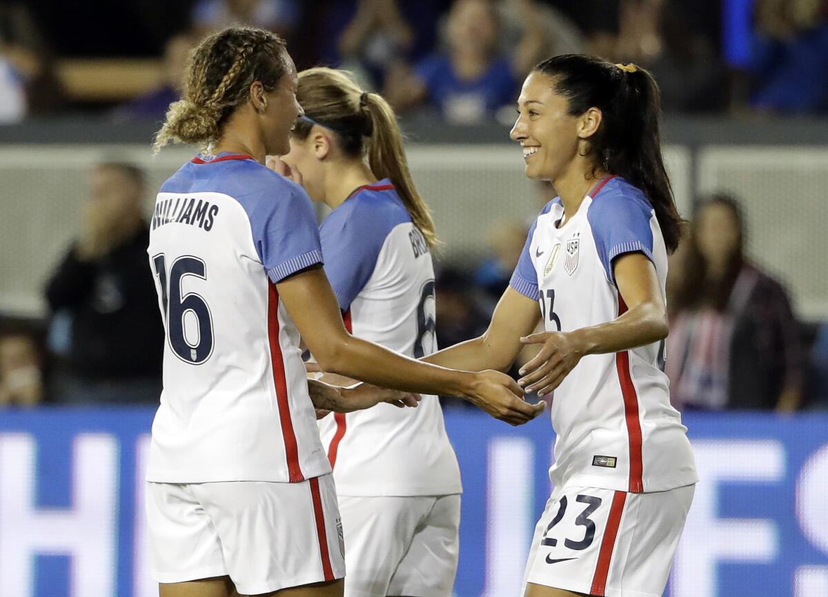 United States forward Christen Press, right, celebrates her goal with teammate Lynn Williams (16) during the first half of an exhibition match against Romania in San Jose on Nov. 10.