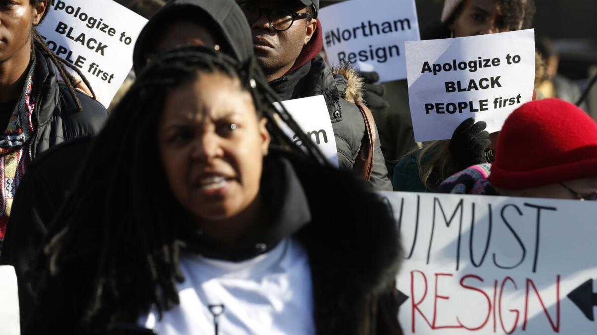 Demonstrators chant outside the governor's mansion at the state Capitol in Richmond, Va., on Saturday.