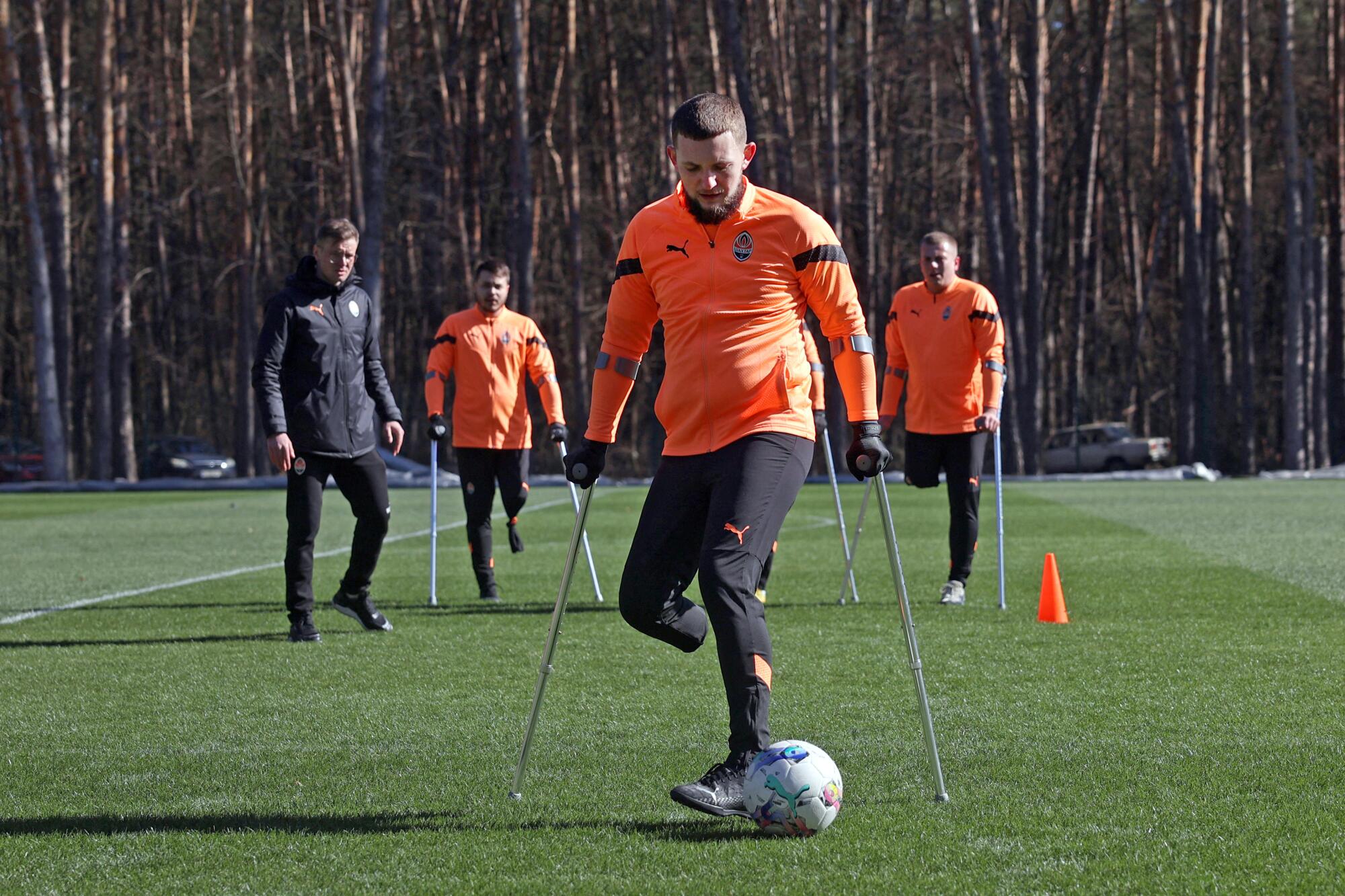 Members of the FC Shakhtar Donetsk soccer team for amputee veterans take part in a training session.