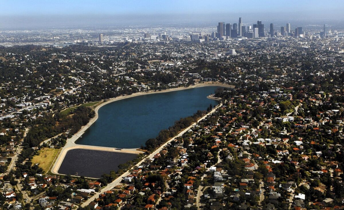 A 2012 aerial view of Silver Lake Reservoir, with the smaller Ivanhoe Reservoir in the foreground and downtown Los Angeles in the distance. The prospect of re-imagining the L.A. landmark has sparked a rush of ideas and enthusiasm.