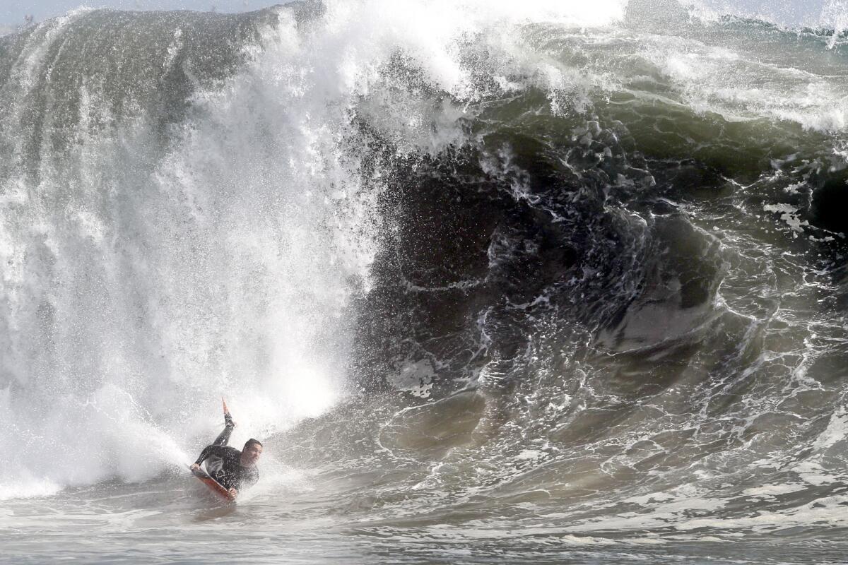 A bodyboarder catches a wave at The Wedge in Newport Beach in March.