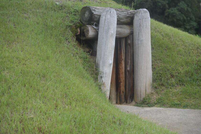 FILE - The entrance to the Earth Lodge, where Native Americans held council meetings for 1,000 years until their forced removal in the 1820s, is seen, Aug. 22, 2022, in Macon, Ga. The lodge would be a highlight of the Ocmulgee National Park and Preserve. Georgia's Congressional delegation introduced legislation Wednesday, May 1, 2024, to protect some of the ancestral lands of the Muscogee tribe as a national park and preserve. (AP Photo/Sharon Johnson, File)