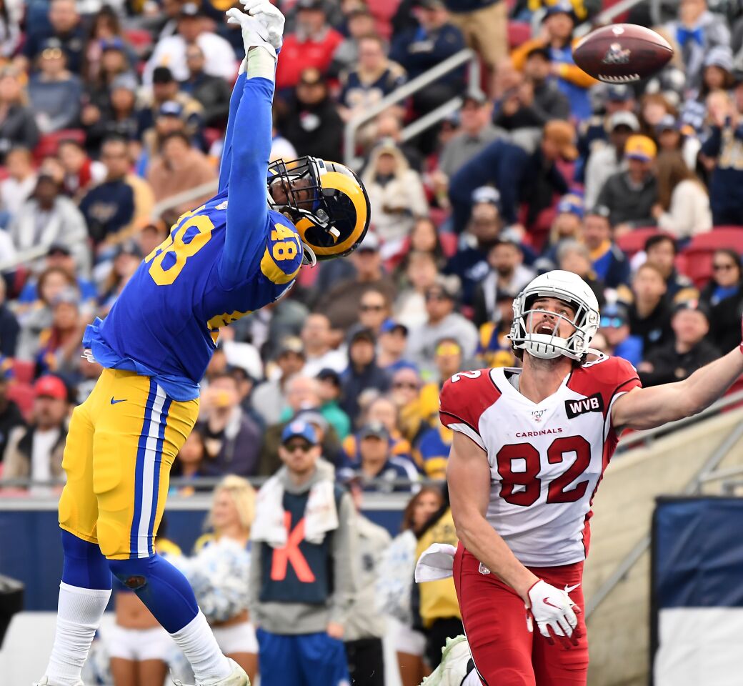 Rams linebacker Travin Howard deflects a pass in the end zone intended for Arizona Cardinals tight end Dan Arnold during the second quarter.