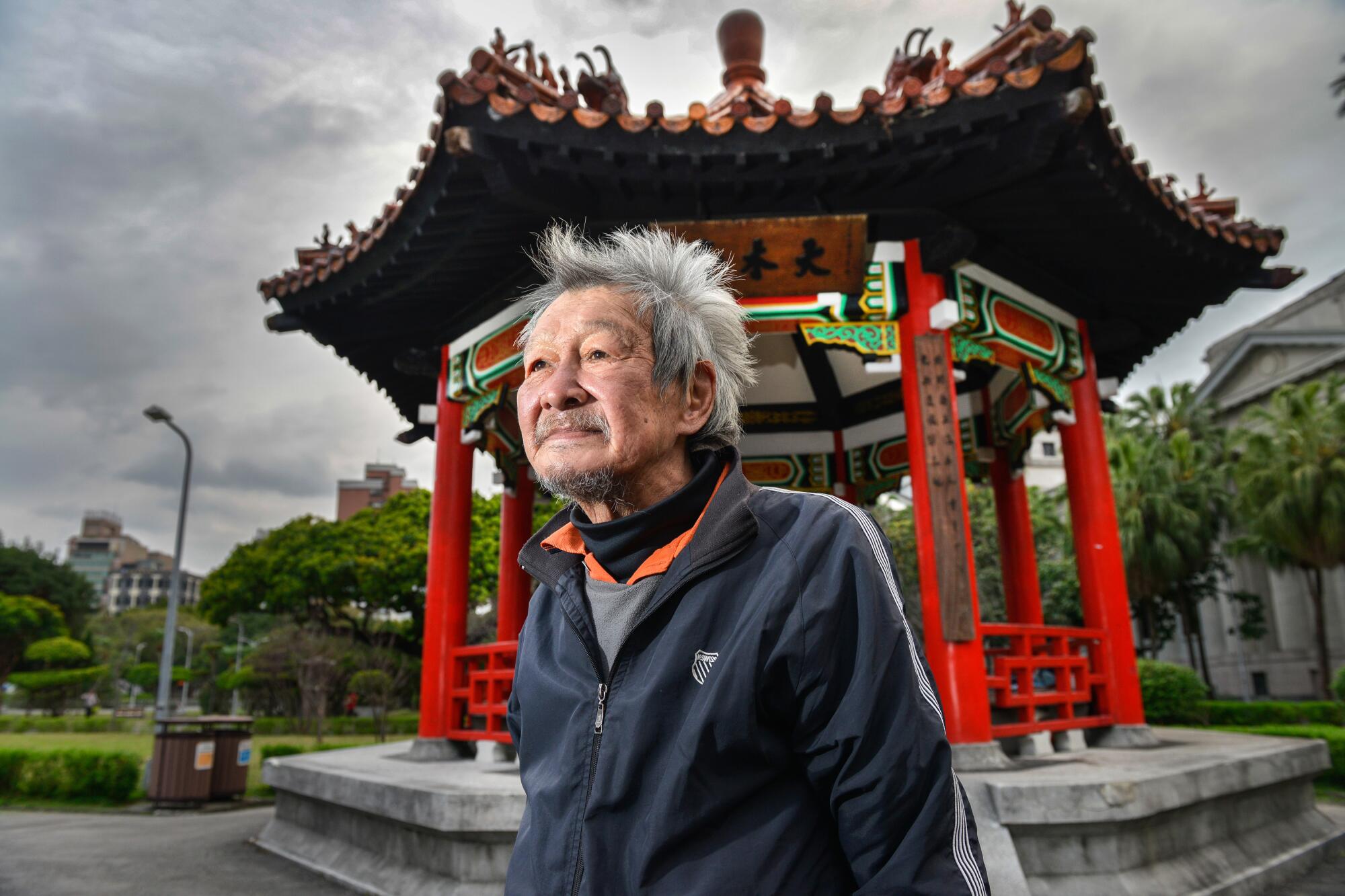 Homeless 73-year old Jimmy Bai in front of the pagoda in central Taipei's 228 Peace Park