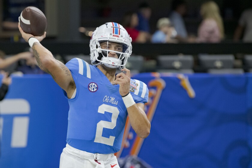 Mississippi quarterback Matt Corral warms up for the team' Sugar Bowl NCAA college football game against Baylor in New Orleans, Saturday, Jan. 1, 2022. (AP Photo/Matthew Hinton)
