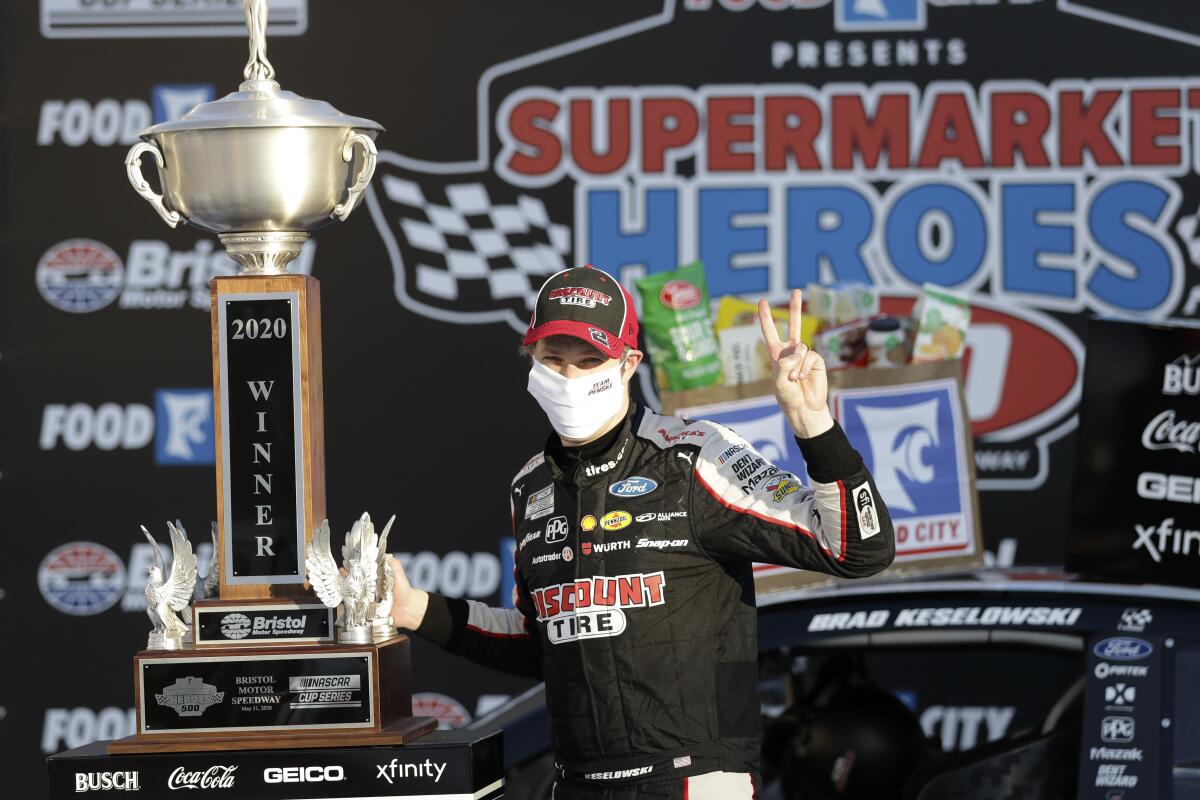 Brad Keselowski celebrates after winning a NASCAR Cup race at Bristol Motor Speedway.