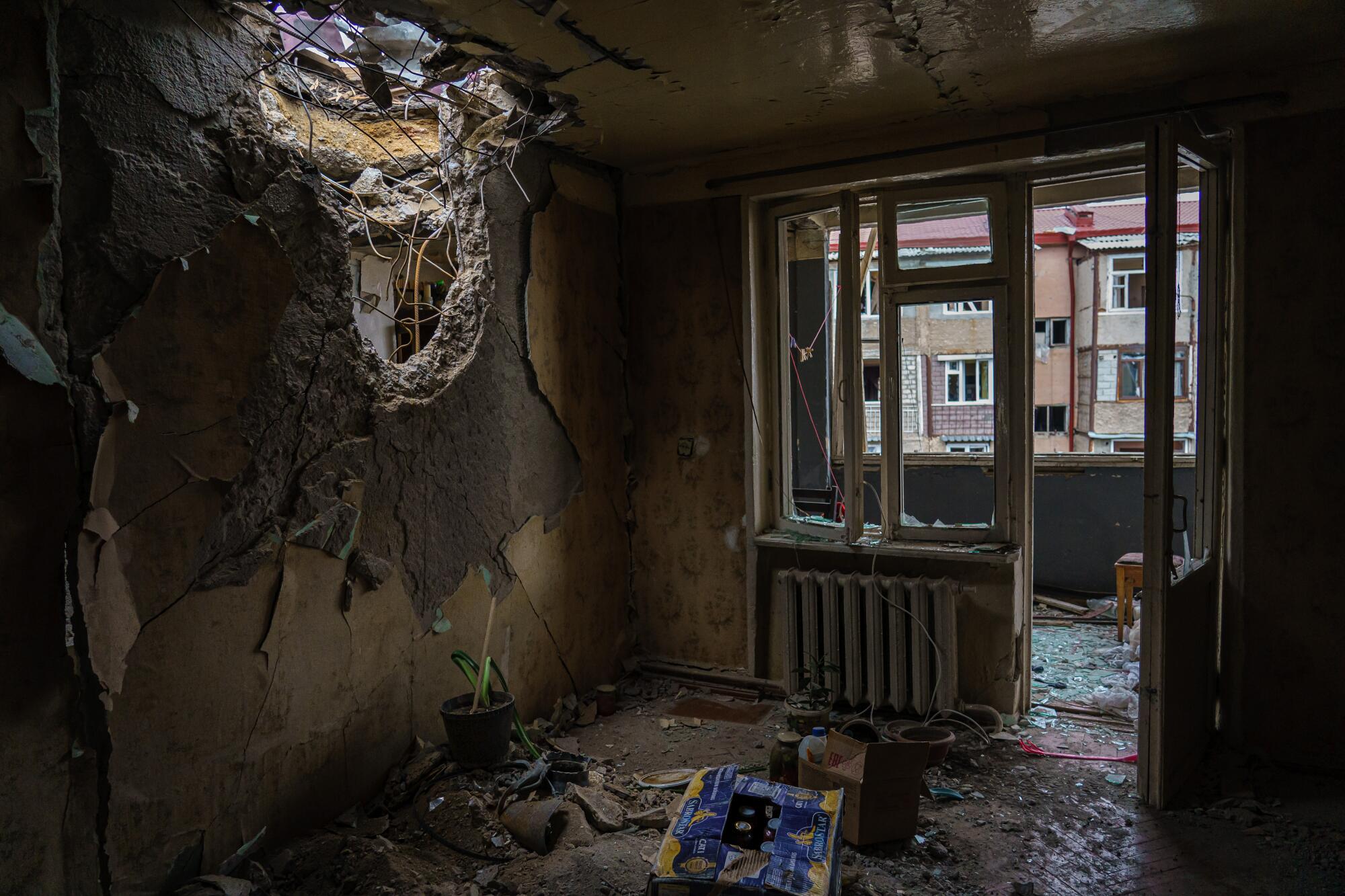  A view inside the living room where a weapon pierced through the ceiling of a residential building.