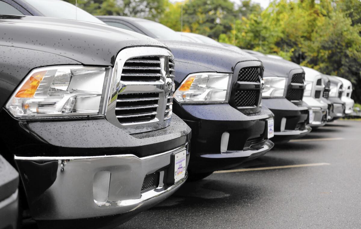 The auto industry sold more than 1 million vehicles in the U.S. last month, a 13.7% gain from the same month a year earlier. Truck sales were especially strong. Above, Dodge Ram pickup trucks at a lot in Haverhill, Mass.