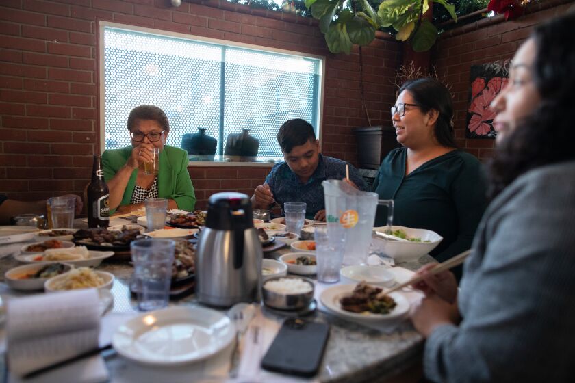 LOS ANGELES, CA - OCTOBER 08: Congresswoman Karen Bass is running against businessman Rick Caruso for mayor of Los Angeles. She has a Korean barbecue dinner with her grandson Michael Pitpitan, 13, and daughters Scythia Lechuga, 34 and Yvette Lechuga, 30, on a recent afternoon. Photographed on Saturday, Oct. 8, 2022 in Los Angeles, CA. (Myung J. Chun / Los Angeles Times)