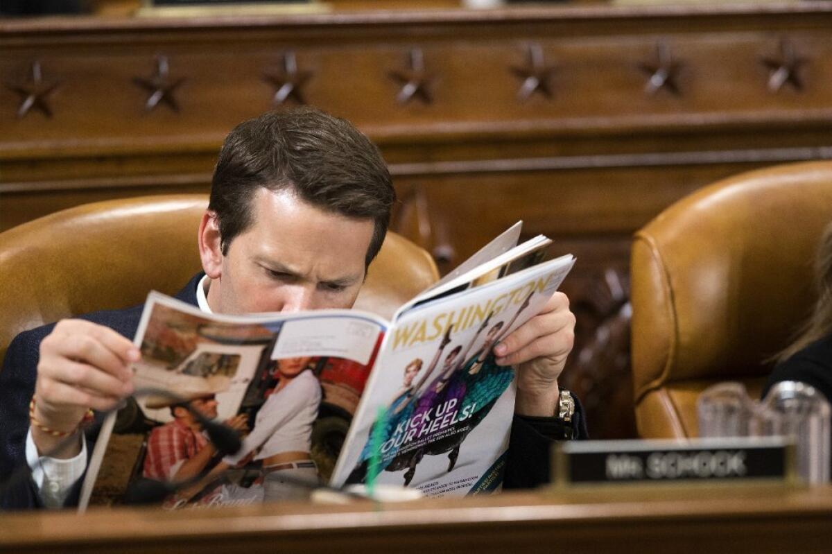 At a 2013 House Ways and Means Committee hearing on President Obama's budget, Rep. Aaron Schock (R-Ill.) perused a magazine. This week, Schock announced he would resign from Congress at month's end.