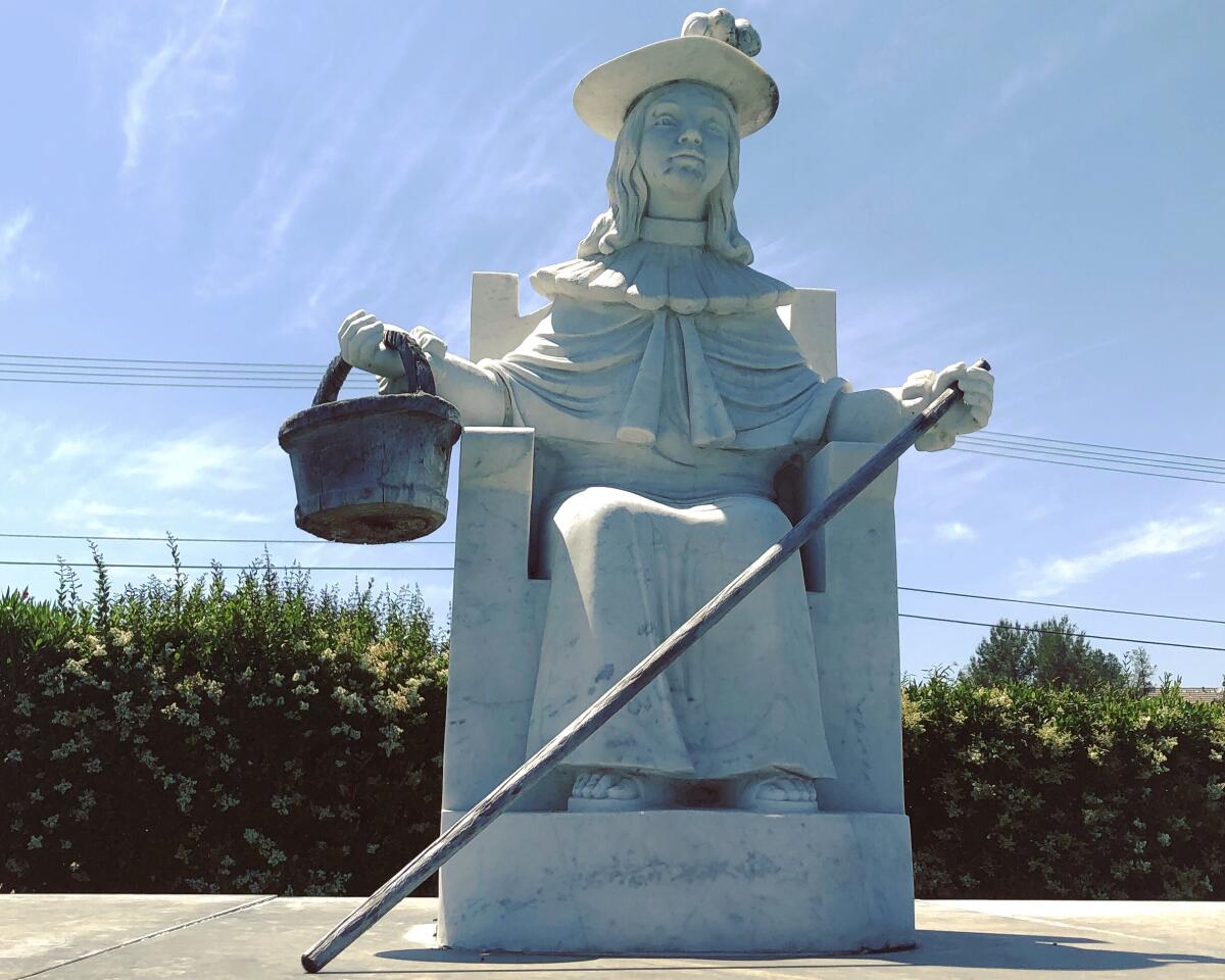 A statue of the Santo Niño de Atocha at Holy Sepulcher Cemetery in Orange.