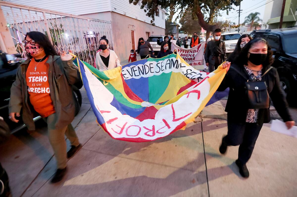 Activists with Tenants United Santa Ana begin their march on the Apartment Assn. of Orange County.