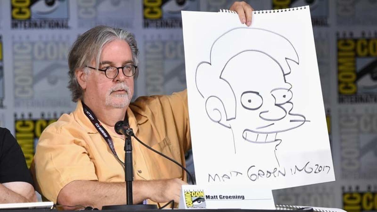 Matt Groening with a drawing of Apu Nahasapeemapetilon at San Diego Comic-Con in July 2017.