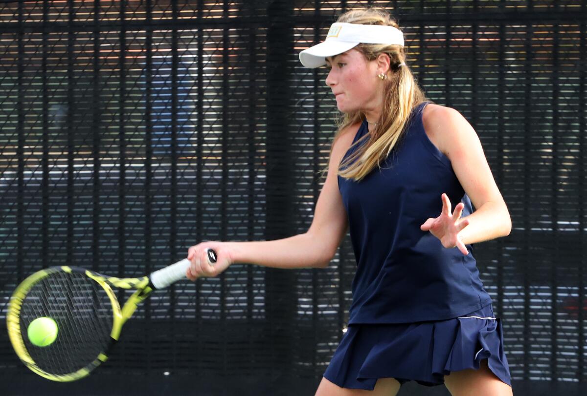 Pacifica Christian's Lexie Macdougal hits a forehand during a girls' tennis final against Mark Keppel.