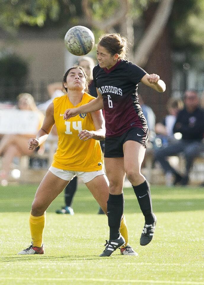 Vanguard's Allie Griffith (14) goes up for a header against Westmont's Kira Nemeth during a game on Tuesday.