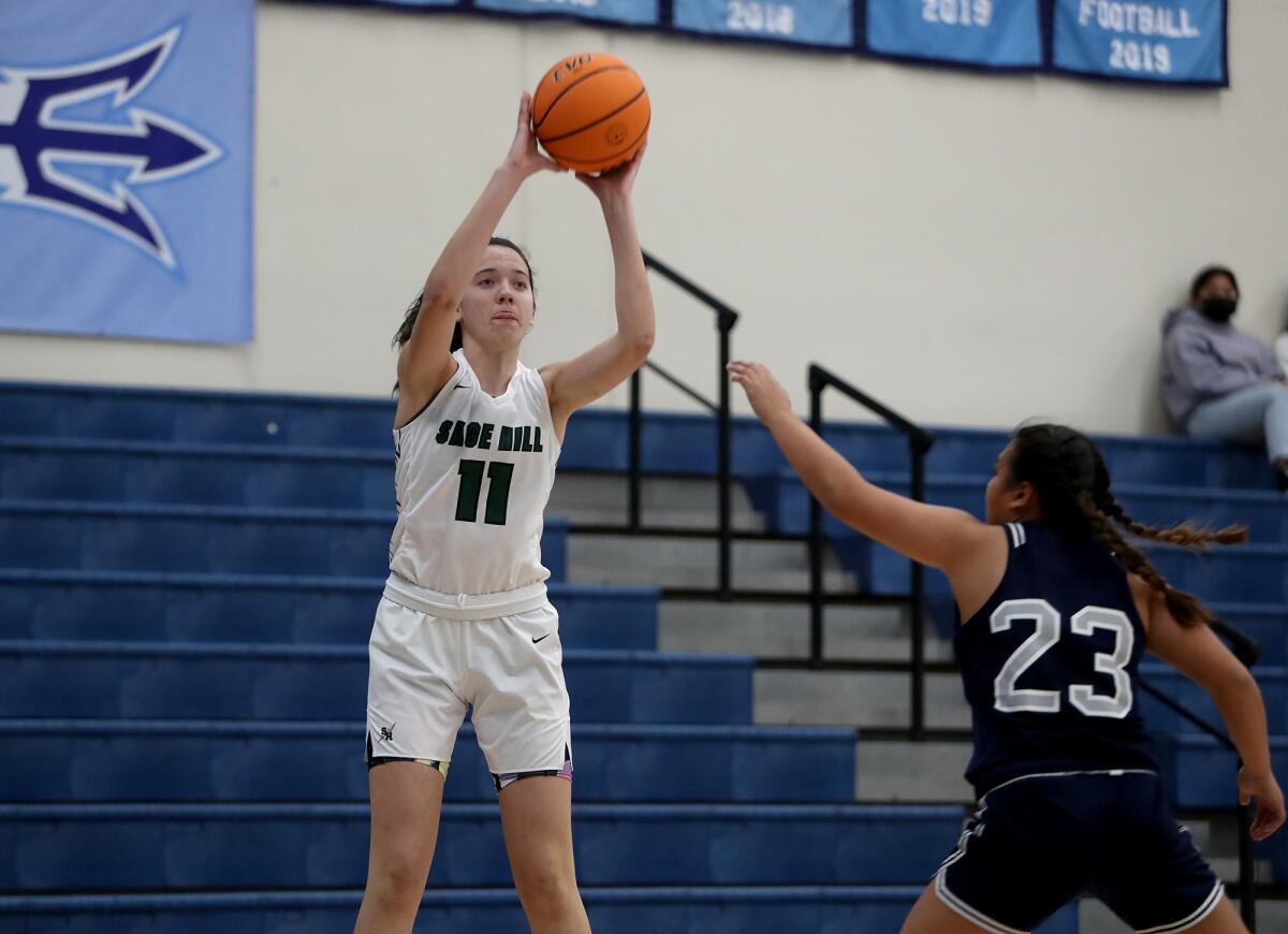 Sage Hill's Kat Righeimer (11) scores a three-pointer in the Corona del Mar Tip-off Tournament in November. 