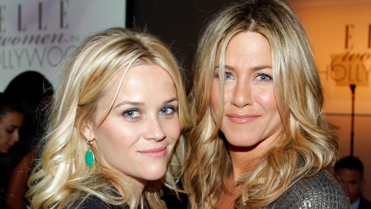 Actresses Jennifer Aniston, left, and Reese Witherspoon, at a Hollywood function in 2011, will reunite for a TV show on Apple.