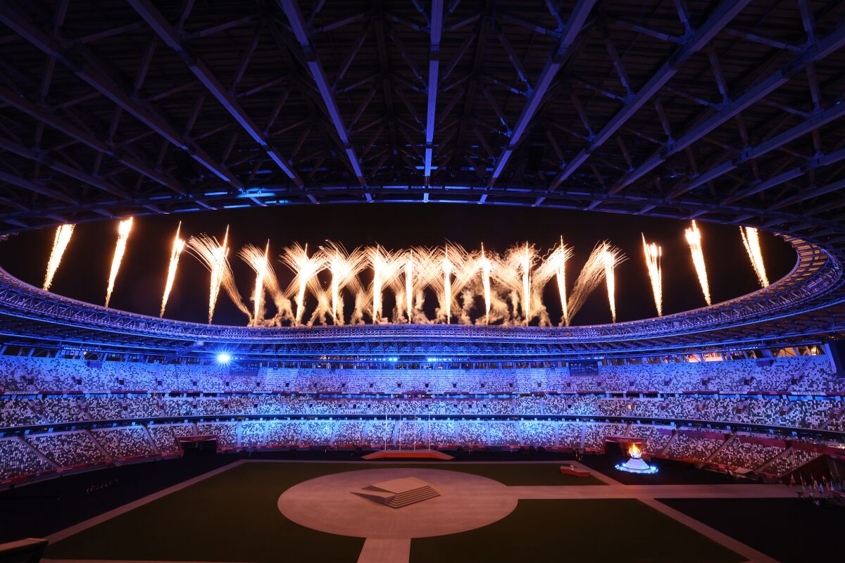 Fireworks goes off over Olympic Stadium during the closing ceremony for the Tokyo Olympic Games.