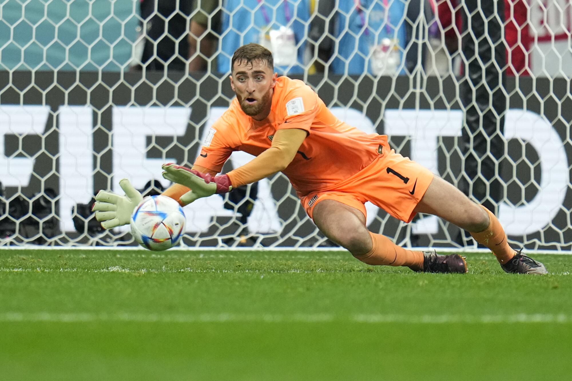 Goalkeeper Matt Turner of the United States makes a save shot by England's Mason Mount.