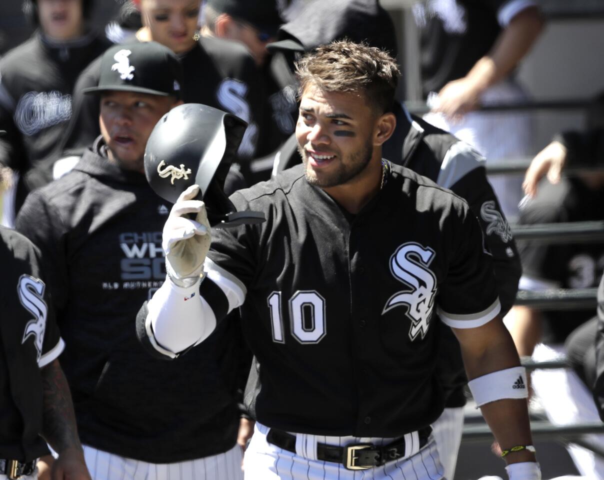 White Sox second baseman Yoan Moncada removes his helmet in the dugout after hitting a home run off Mariners starter Felix Hernandez during the first inning Wednesday, April 25, 2018.