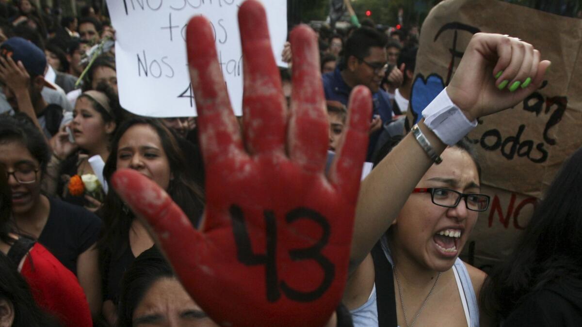In 2014, demonstrators in Mexico City protest the disappearance of 43 students in the Mexican state of Guerrero.