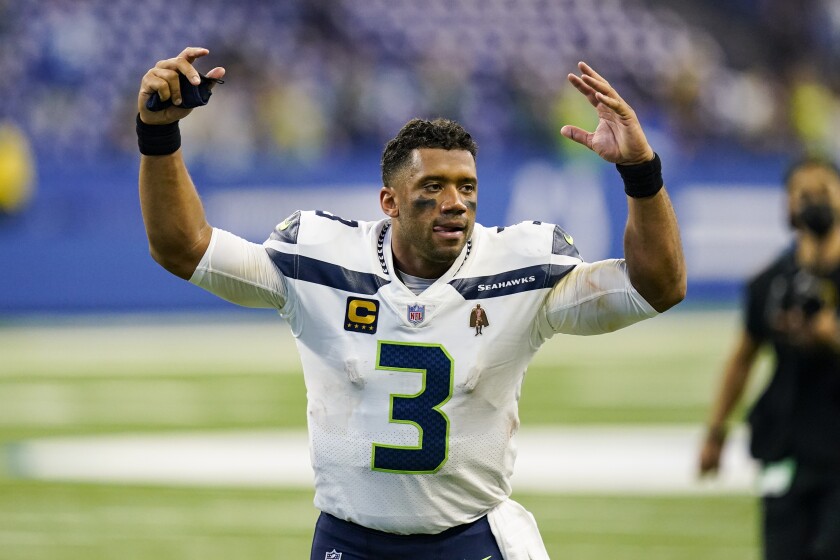 Seattle Seahawks quarterback Russell Wilson (3) waves to fans as he leaves the field following a 28-16 win over the Indianapolis Colts in an NFL football game in Indianapolis, Sunday, Sept. 12, 2021. (AP Photo/Charlie Neibergall)