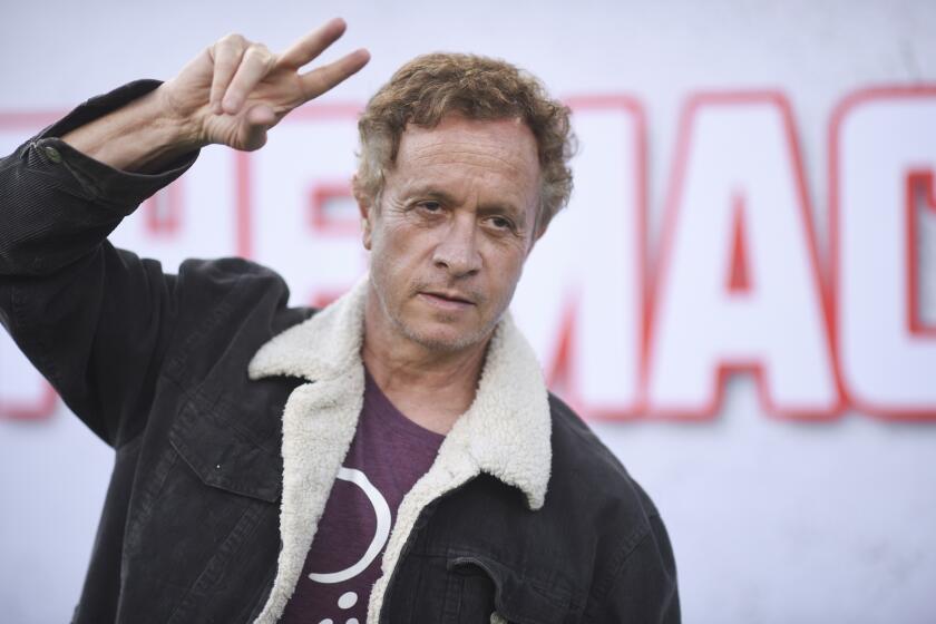 Pauly Shore making a peace sign at a screening of "The Machine" at the Regency Village Theatre in 2023