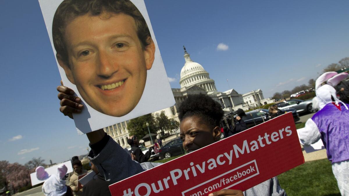 A demonstrator outside the U.S. Capitol on April 10, ahead of Facebook CEO Mark Zuckerberg's congressional testimony.