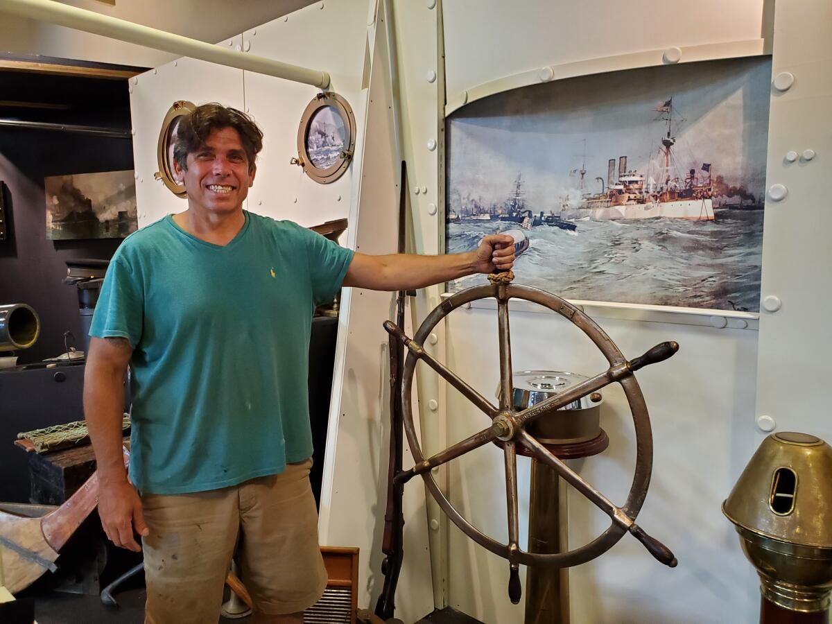 "Permission to Come Aboard" curator Joe Frangiosa Jr. stands in his in-development Spanish-American War ship booth.