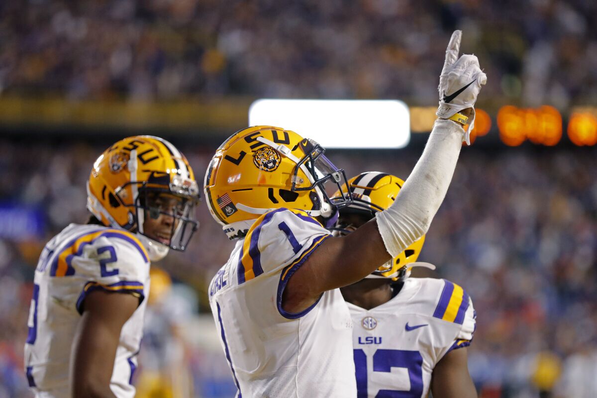 LSU wide receiver Ja'Marr Chase (1) celebrates his touchdown reception in the second half Saturday.