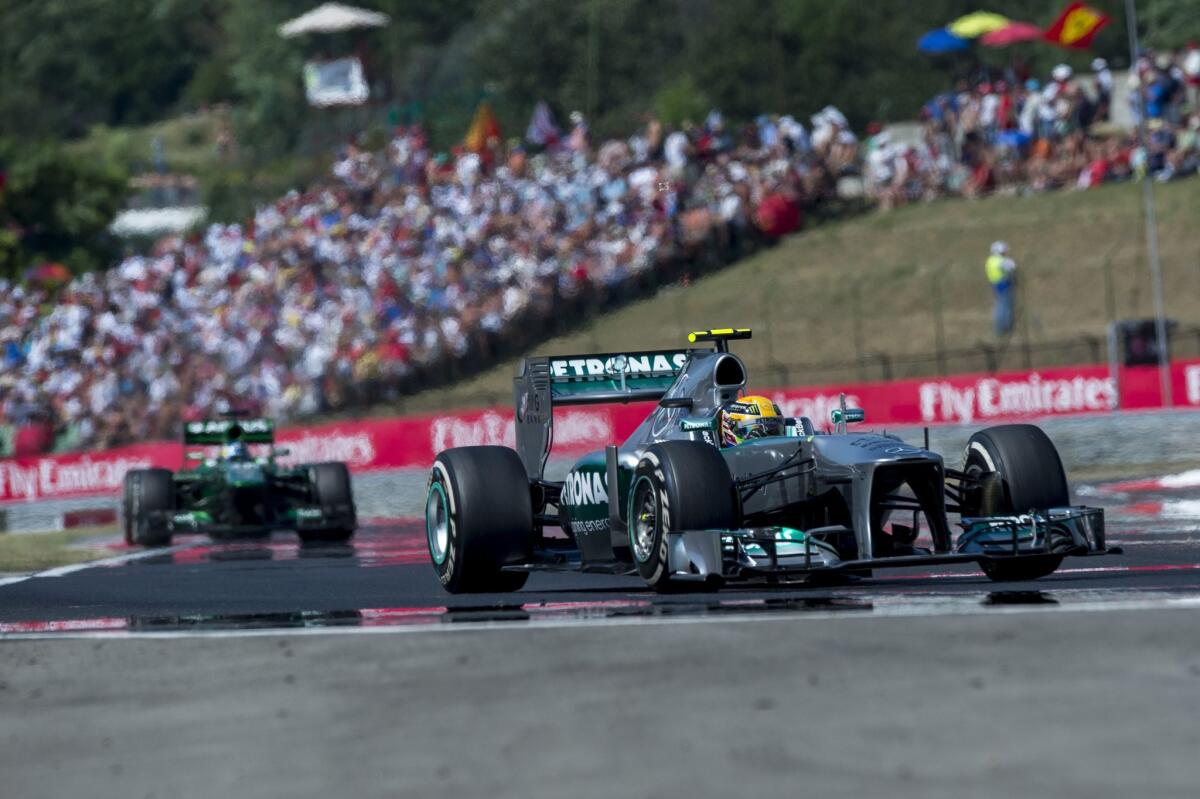 Lewis Hamilton won the Hungarian Grand Prix for the second year in a row from the pole position.