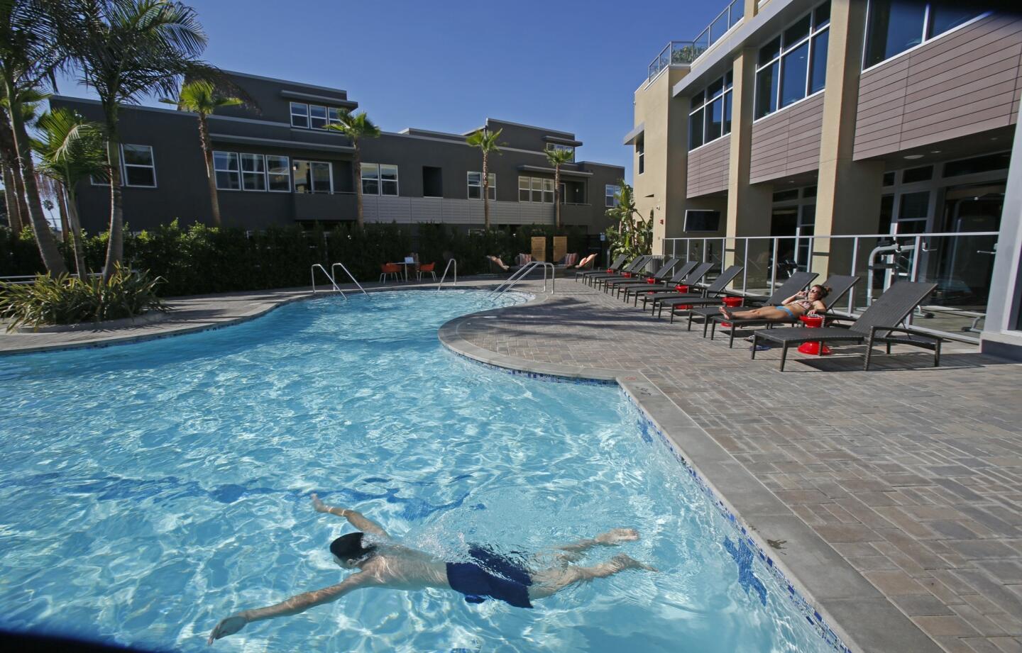 Wesley Ong swims laps in the pool at the Lincoln Place apartments in Venice