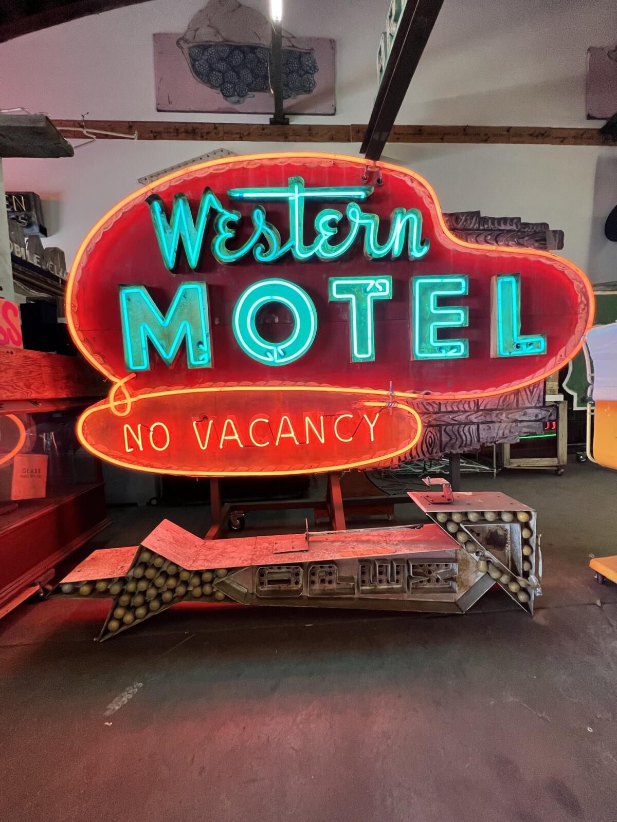 a neon Western Motel sign.