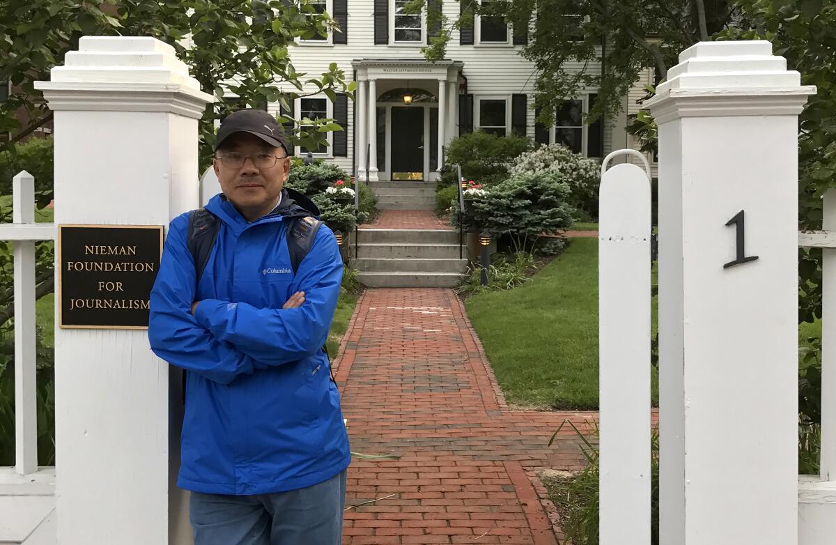 Dong Yuyu standing outside Nieman Foundation for Journalism at Harvard University