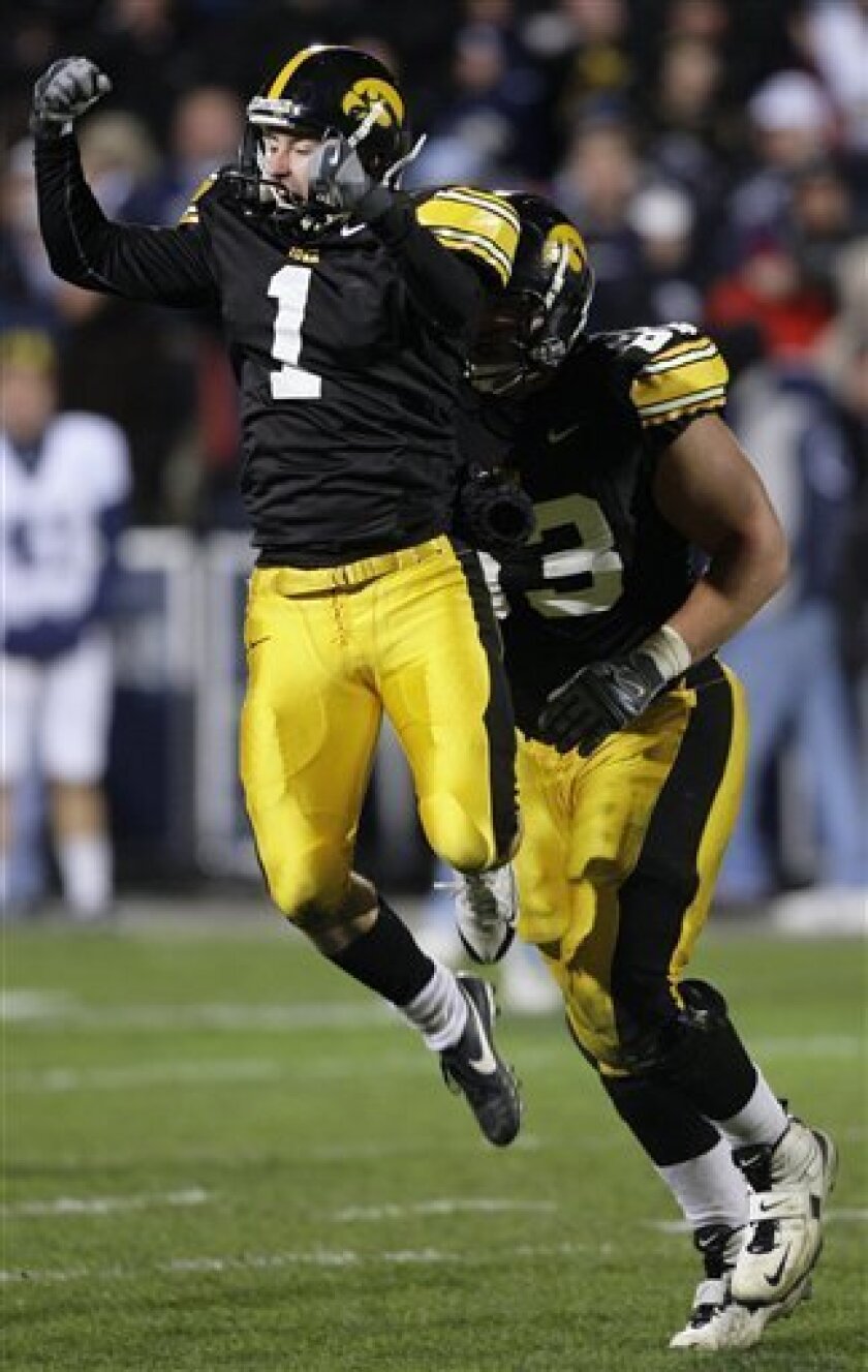Iowa's Daniel Murray (1) celebrates after kicking the game-winning 31-yard field goal in the closing seconds of the fourth quarter of an NCAA college football game against Penn State, Saturday, Nov. 8, 2008, in Iowa City, Iowa. Iowa won 24-23. (AP Photo/Charlie Neibergall)