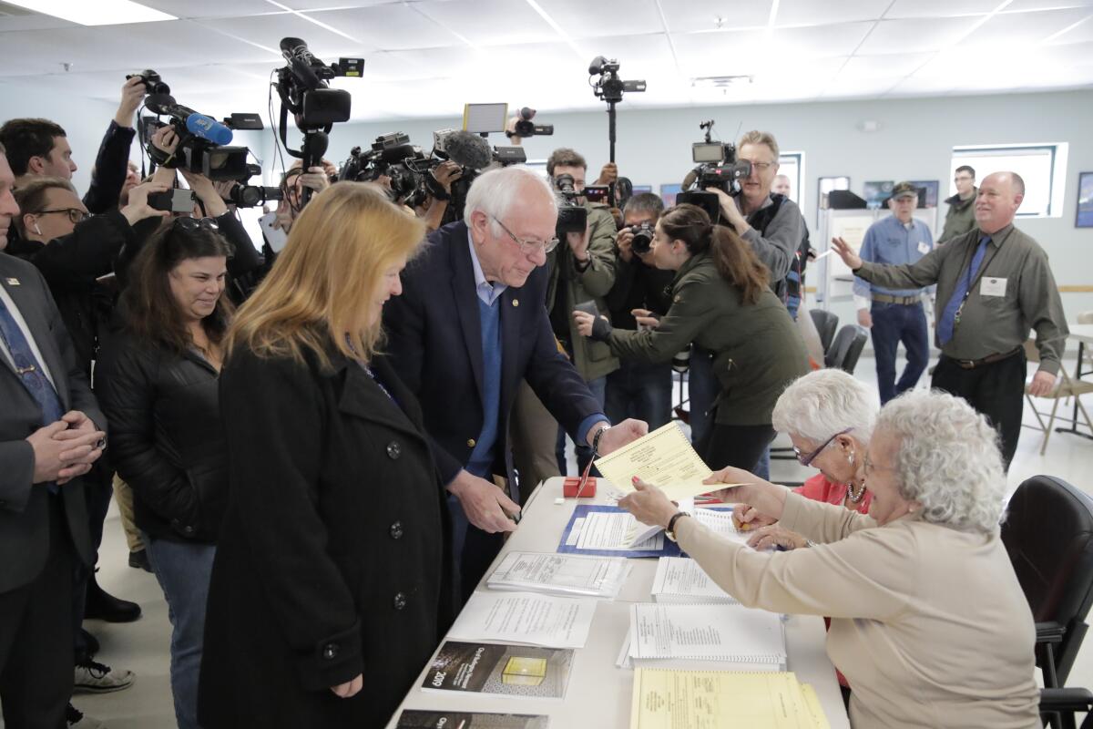 Sen. Bernie Sanders arrives to vote in the Vermont primary near his home in Burlington.