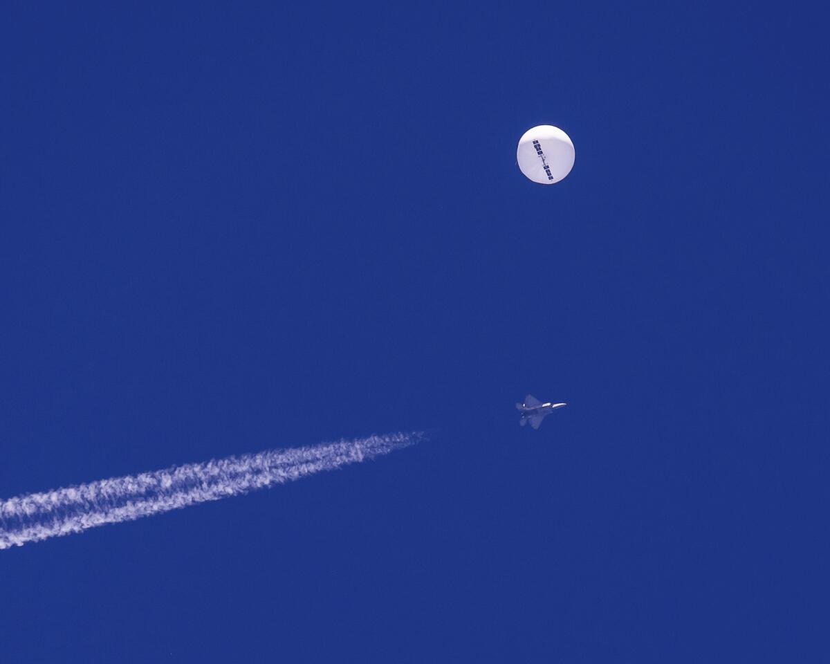 a large balloon drifts above the Atlantic Ocean