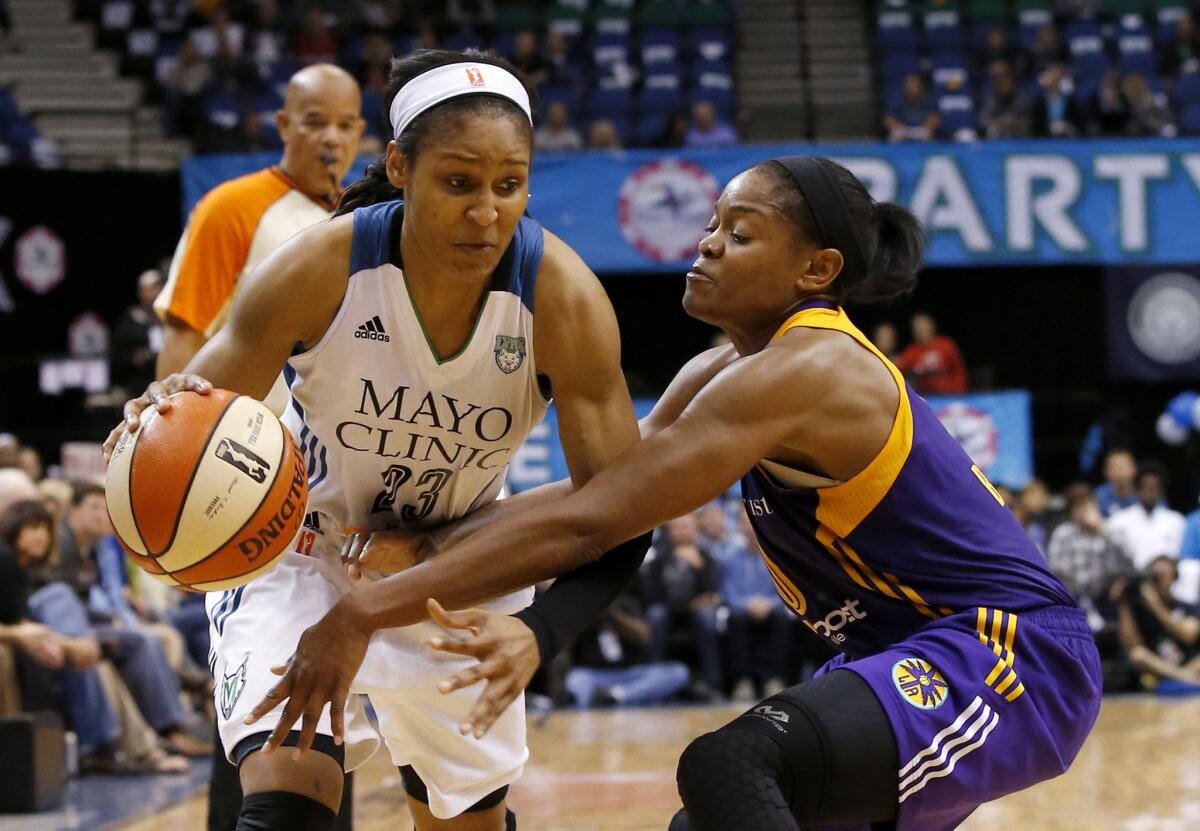 Lynx forward Maya Moore drives against Sparks guard Alana Beard during the second half of Game 1 of the WNBA Western Conference semifinals.