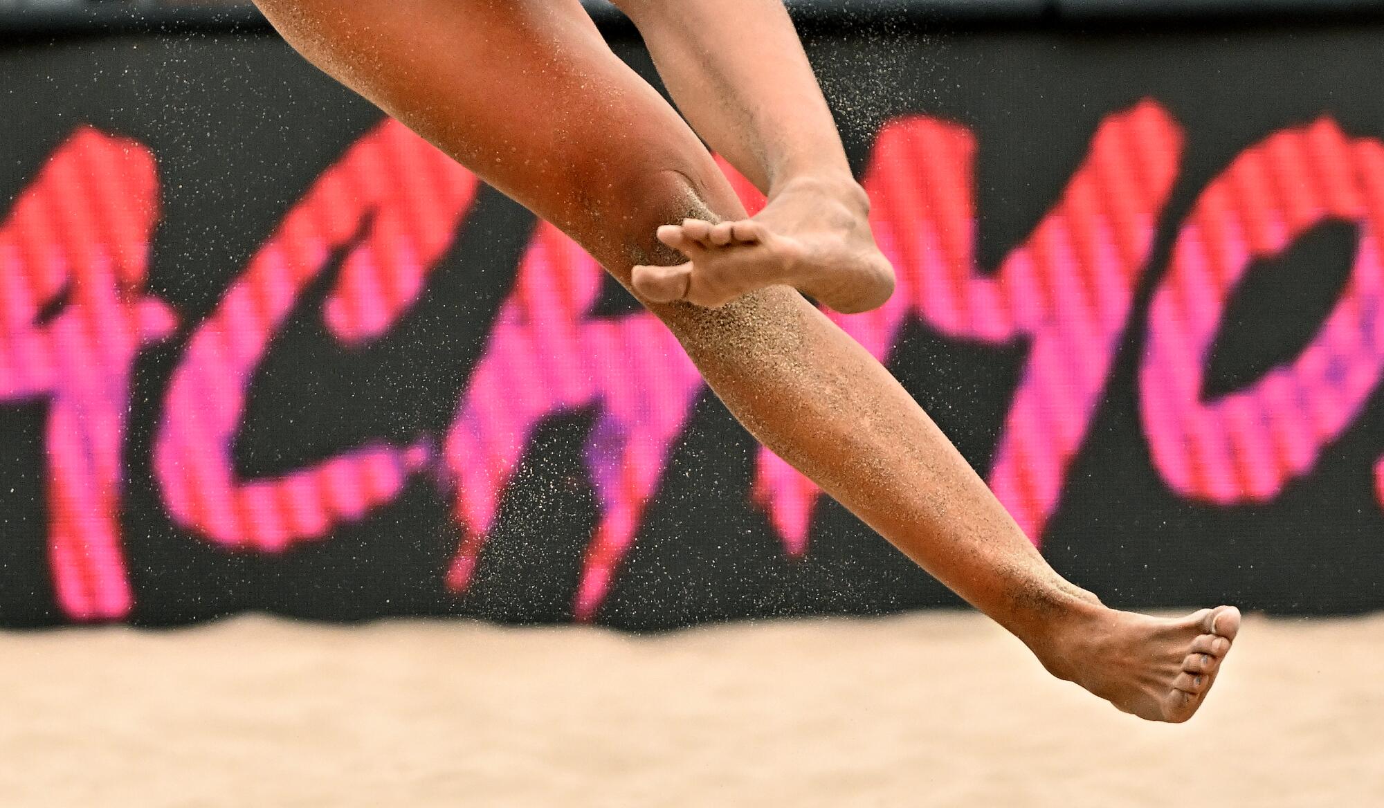 Emily Stockman spikes the ball during a quarterfinal match.