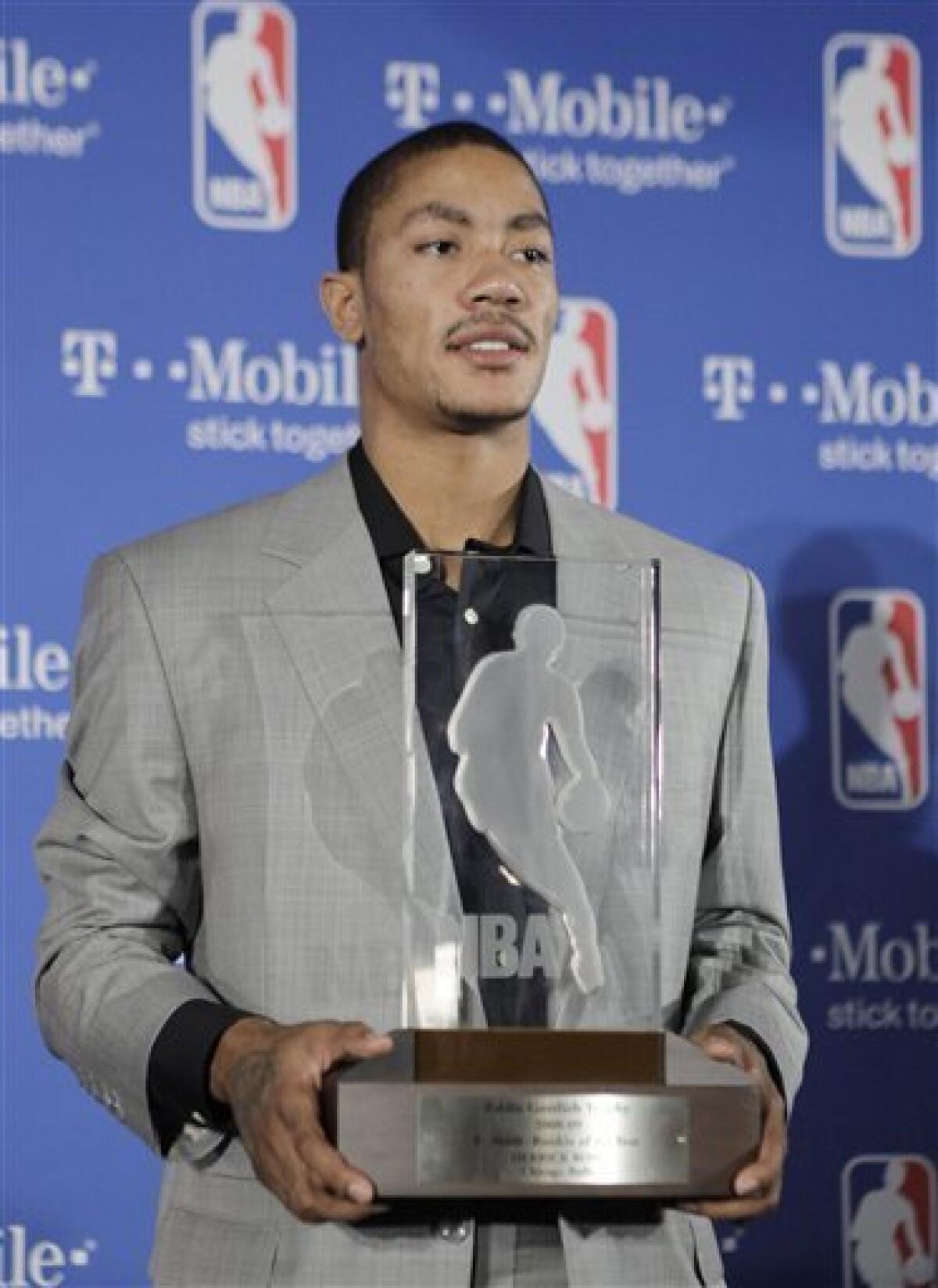 Chicago Bulls' Derrick Rose holds NBA Rookie of the Year trophy on Wednesday, April 22, 2009, in Northbrook, Ill. Rose became the third Bulls player to win the award Wednesday, joining Michael Jordan and Elton Brand. 