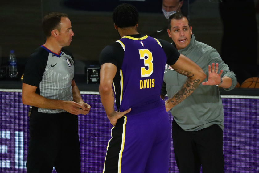 Lakers coach Frank Vogel and forward Anthony Davis speak with a referee.