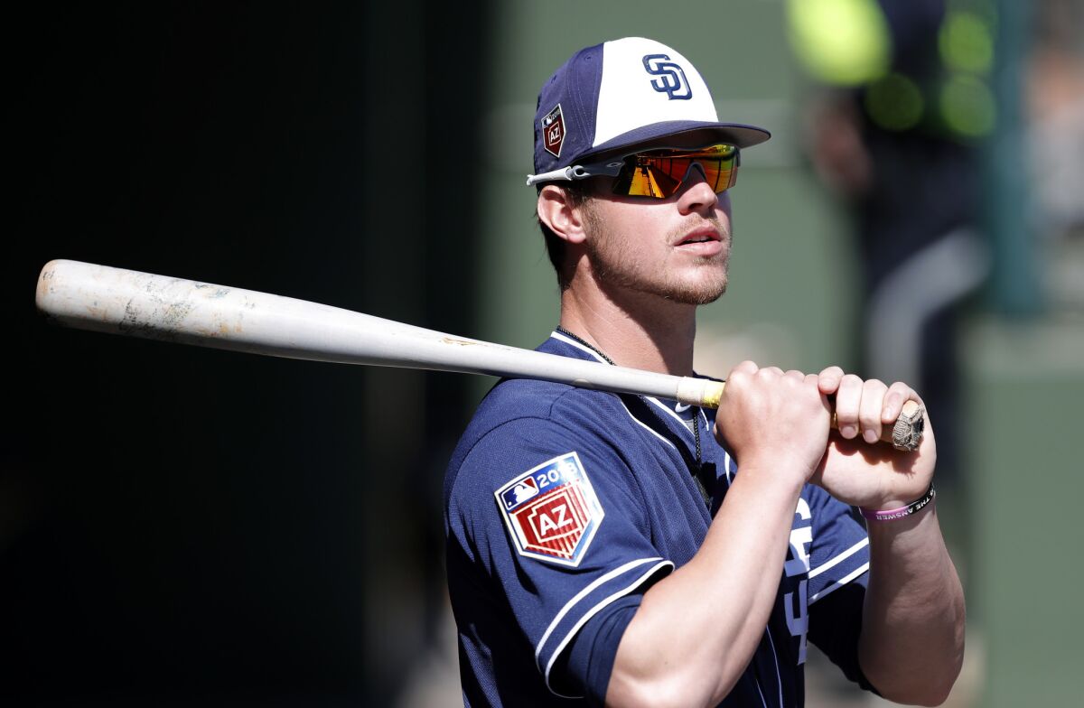 Wil Myers stands in the dugout before a spring training baseball game against the Texas Rangers, Thursday, March 1, 2018, in Surprise, Ariz.