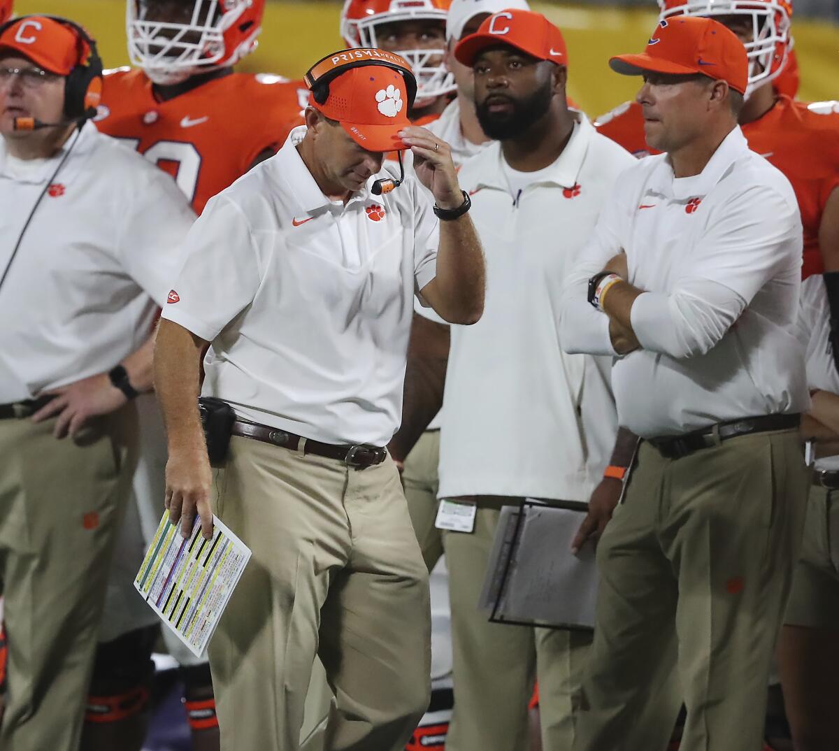 Clemson coach Dabo Swinney reacts after a sack while walking the sideline during the second half of the team's NCAA college football game against Georgia on Saturday, Sept. 4, 2021, in Charlotte, N.C. (Curtis Compton/Atlanta Journal-Constitution via AP)